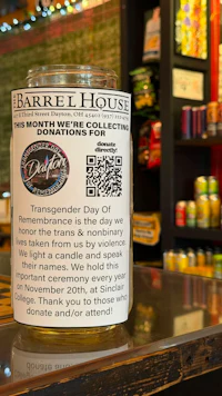 a jar with a qr code on it sits on a counter