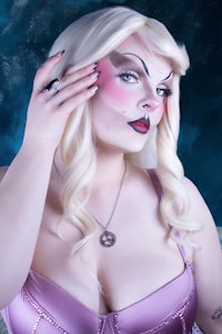 a woman in a pink lingerie posing for a picture